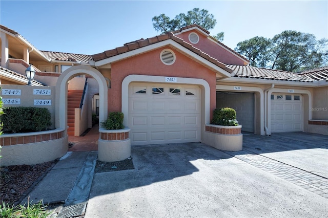 mediterranean / spanish-style home featuring a garage