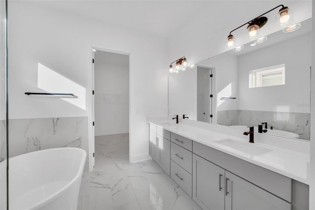 bathroom with vanity and a bathtub