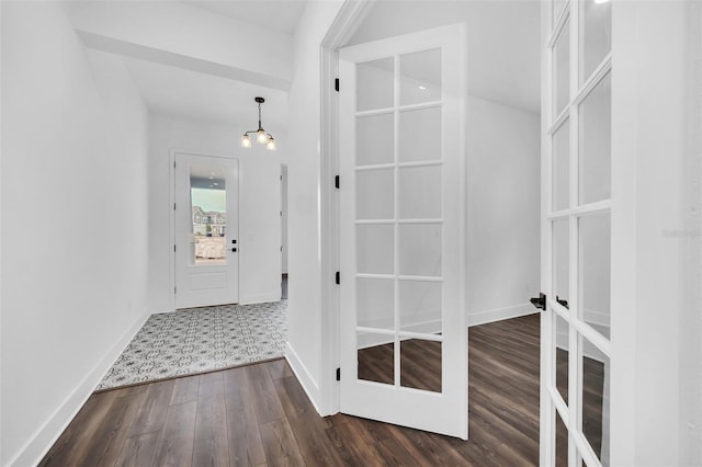 interior space with dark hardwood / wood-style floors and french doors