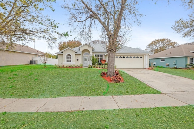 single story home with a garage, central AC, and a front lawn