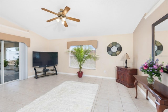 living room with lofted ceiling, light tile patterned floors, and ceiling fan