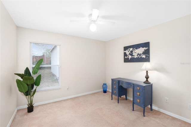 office area featuring light colored carpet and ceiling fan