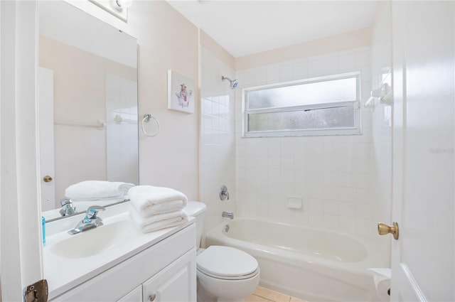 full bathroom featuring vanity, toilet, and tiled shower / bath