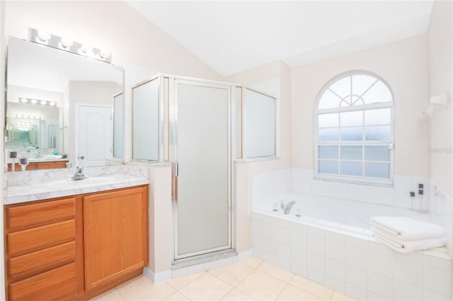 bathroom featuring vaulted ceiling, separate shower and tub, tile patterned floors, and vanity