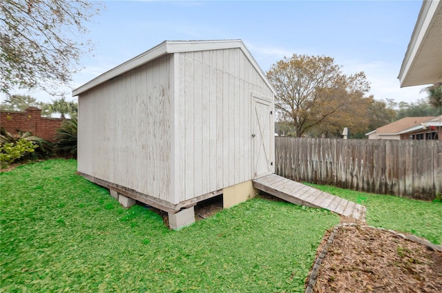 view of outbuilding with a lawn