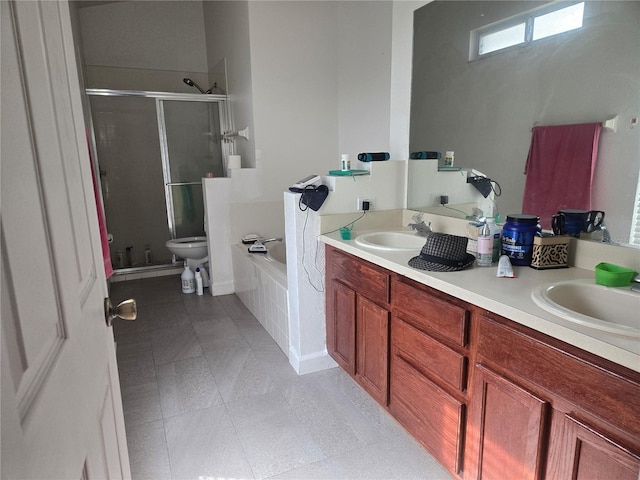 bathroom with tile patterned flooring, a sink, a shower stall, and double vanity