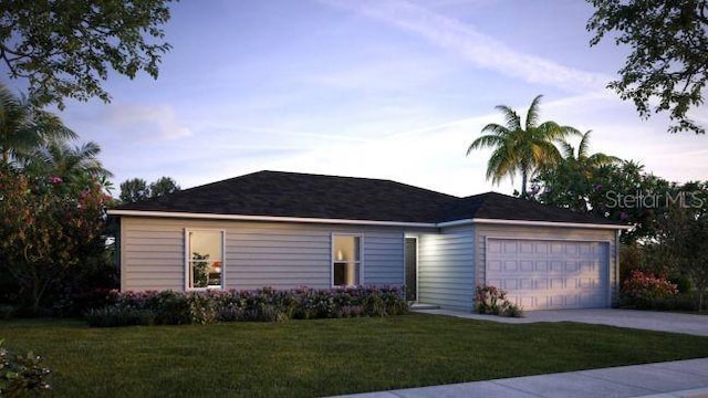 single story home with a garage and a lawn