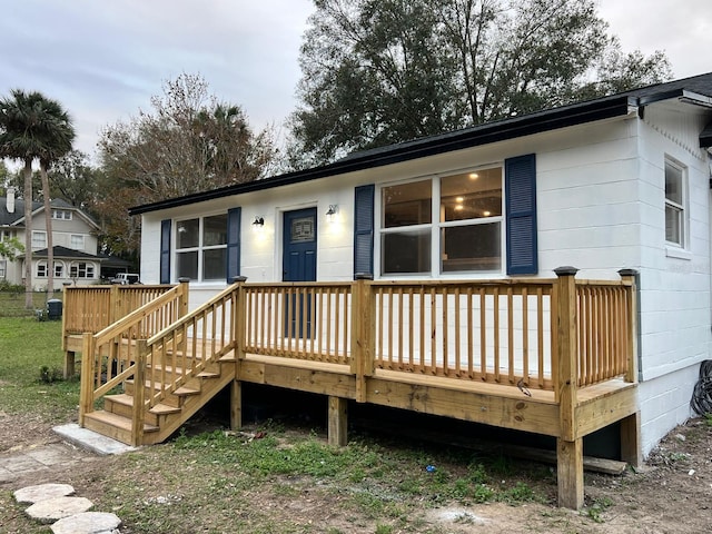 back of house featuring a wooden deck