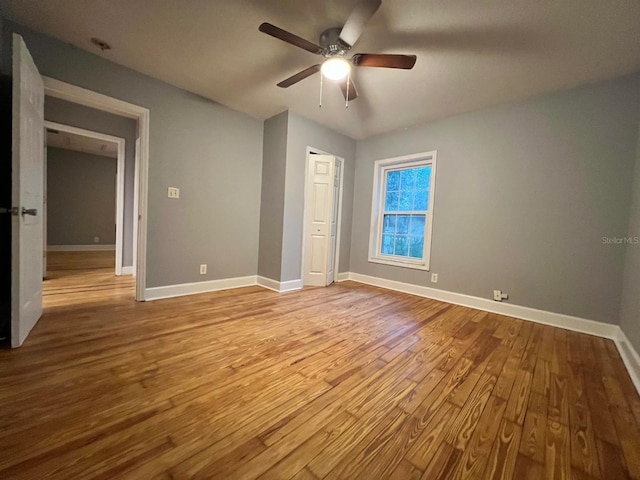 unfurnished bedroom featuring ceiling fan and light wood-type flooring