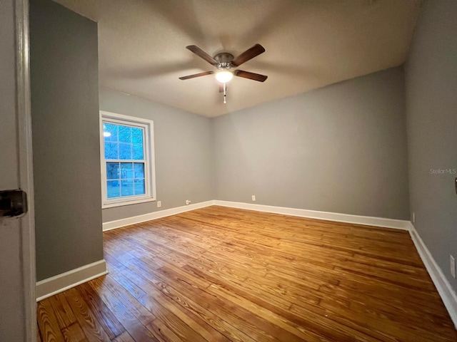 spare room featuring ceiling fan and light hardwood / wood-style floors