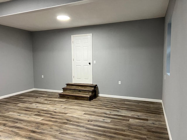 empty room featuring dark wood-type flooring