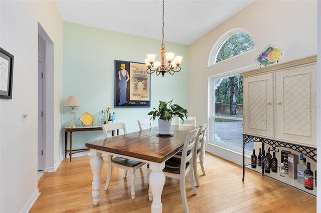 dining room featuring an inviting chandelier and light hardwood / wood-style floors
