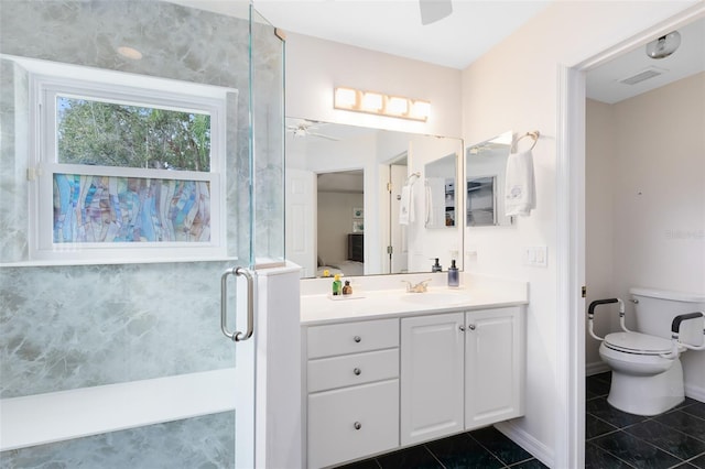 bathroom featuring vanity, an enclosed shower, ceiling fan, toilet, and tile patterned floors