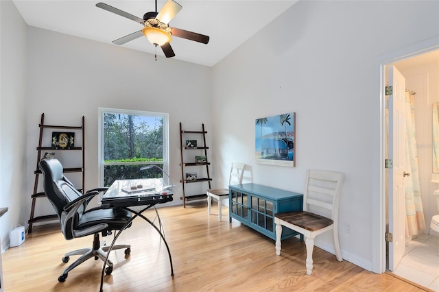 home office featuring light wood-type flooring and ceiling fan