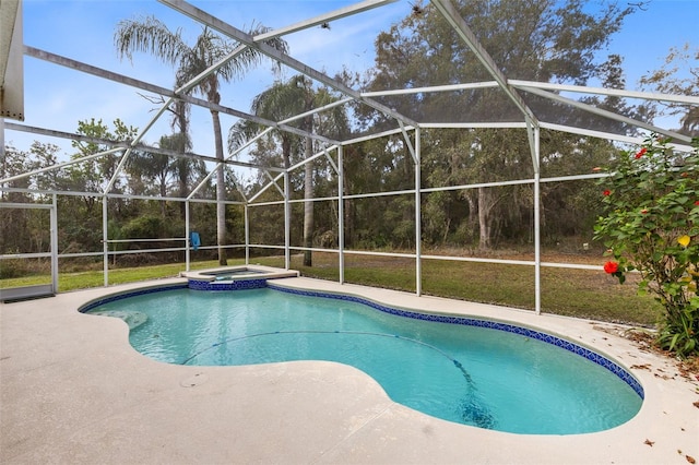 view of swimming pool featuring a patio, an in ground hot tub, and a lanai