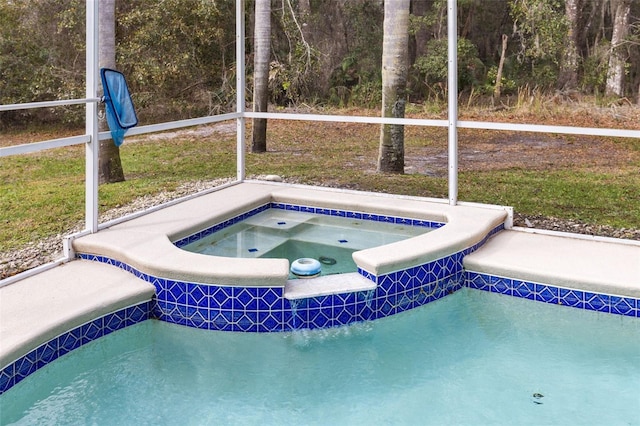 view of swimming pool featuring an in ground hot tub