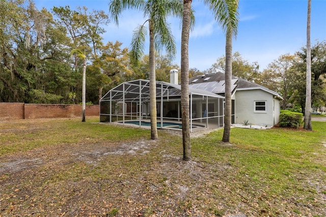 view of yard featuring a lanai