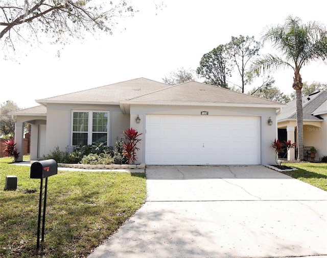 ranch-style house with a front yard, driveway, an attached garage, and stucco siding