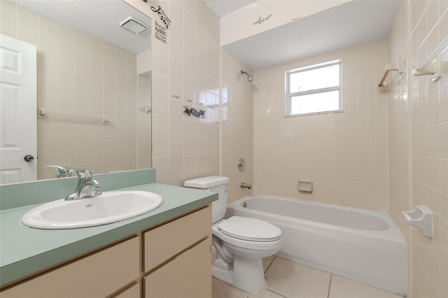 full bath featuring toilet, a textured ceiling, shower / tub combination, vanity, and tile patterned floors