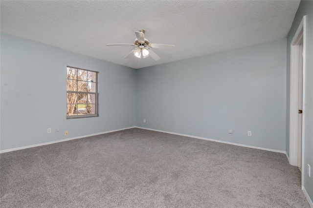 unfurnished room featuring carpet flooring, ceiling fan, and a textured ceiling