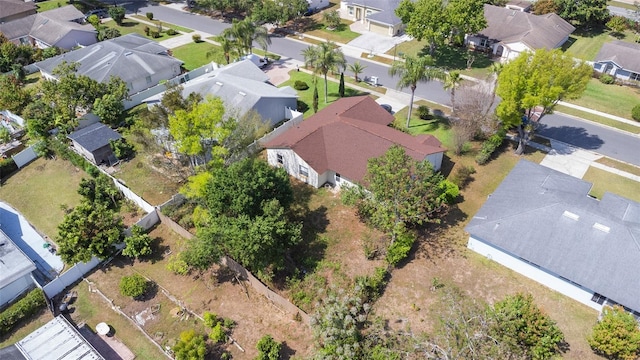 birds eye view of property with a residential view