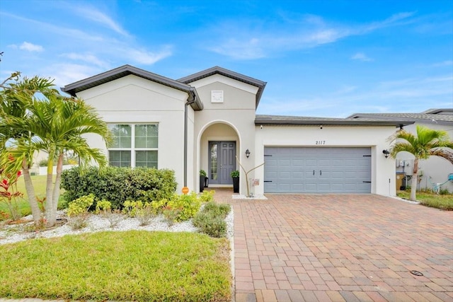 view of front of home with a garage and a front yard