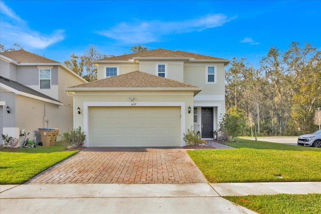 front facade with a front yard and a garage