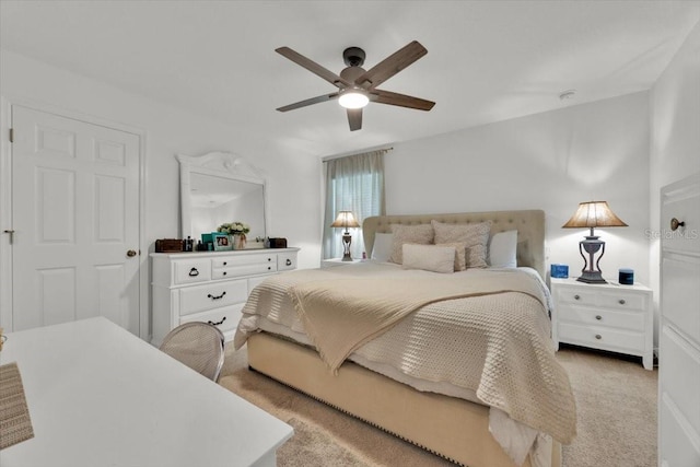 bedroom with light colored carpet and ceiling fan