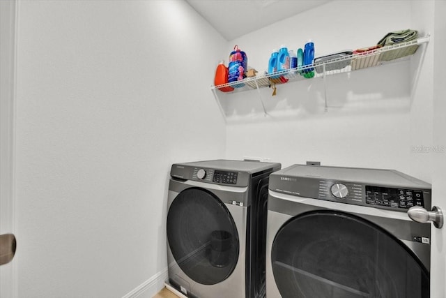 laundry room featuring separate washer and dryer