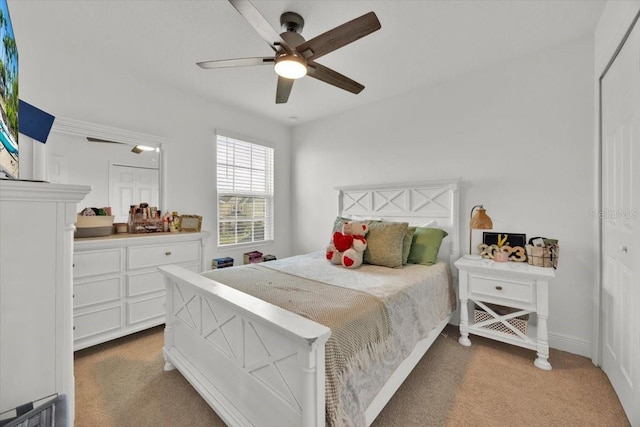 carpeted bedroom with ceiling fan