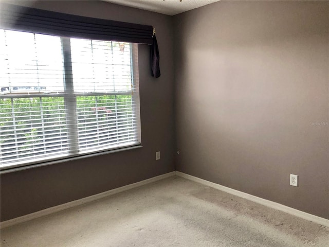 2628 Caribe Dr, The Villages, FL 32162 - unfurnished room featuring light carpet and baseboards