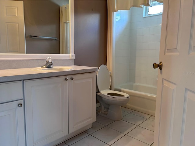 2628 Caribe Dr, The Villages, FL 32162 - full bath featuring vanity, tile patterned floors, and shower / bath combo with shower curtain