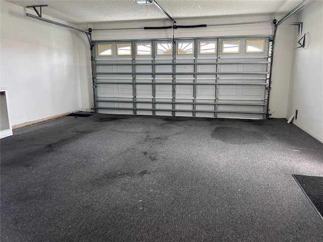 2628 Caribe Dr, The Villages, FL 32162 - garage featuring baseboards