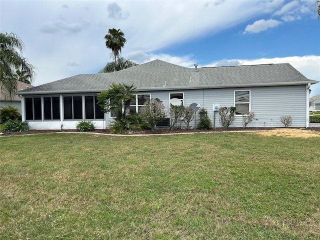 2628 Caribe Dr, The Villages, FL 32162 - rear view of house with a yard and roof with shingles