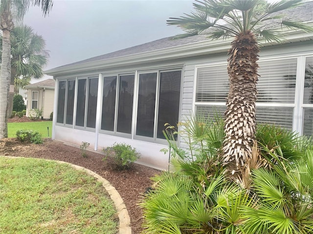 2628 Caribe Dr, The Villages, FL 32162 - view of side of home featuring a sunroom