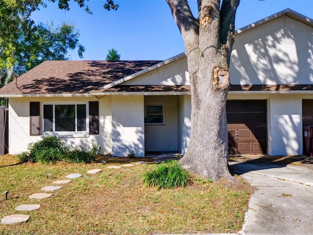 single story home featuring a garage