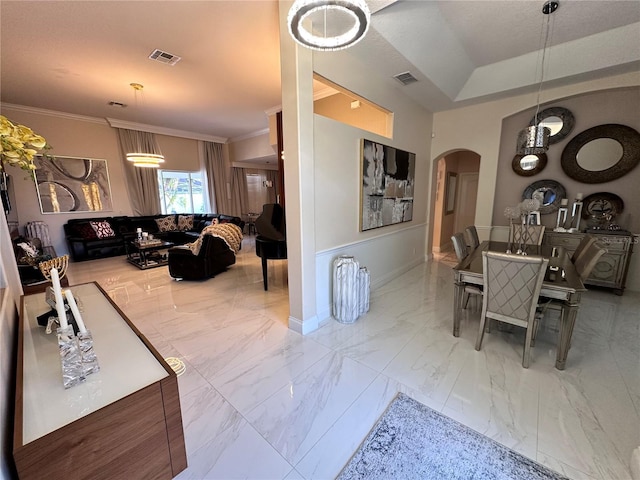 dining area with arched walkways, marble finish floor, visible vents, and crown molding