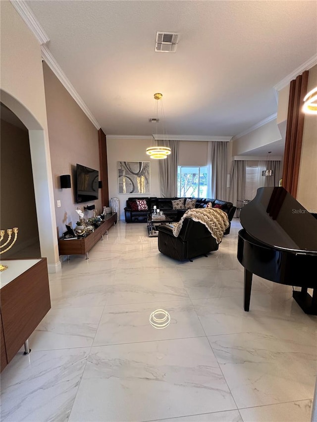 living room with marble finish floor, visible vents, arched walkways, and ornamental molding