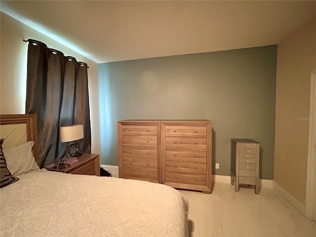 bedroom featuring baseboards