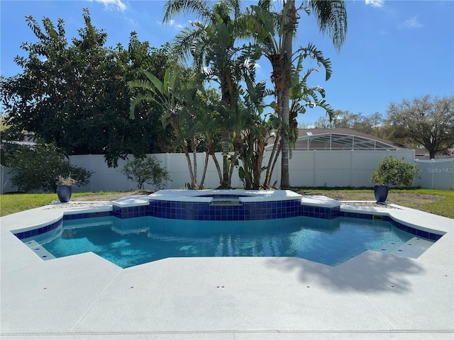 view of pool featuring an in ground hot tub, a fenced backyard, and a fenced in pool