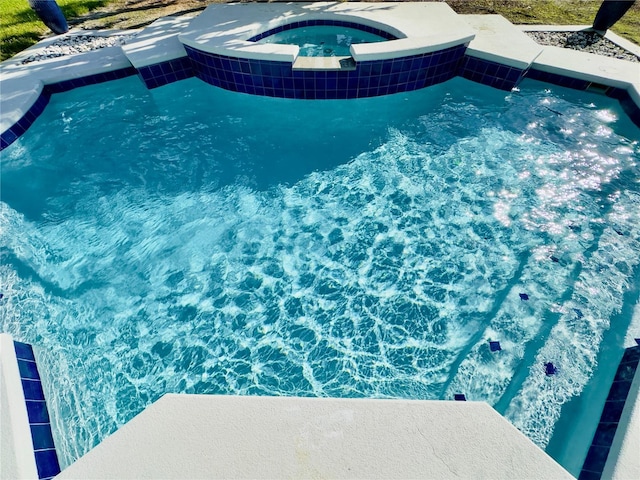 pool with an in ground hot tub