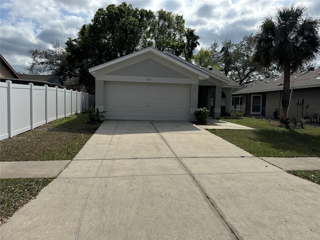 view of front of home featuring a front lawn and a garage