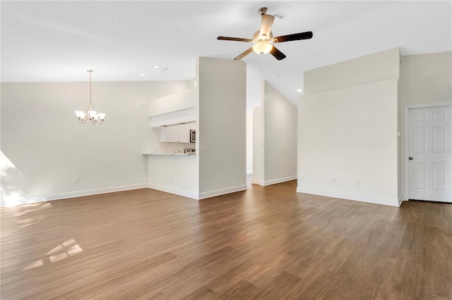 unfurnished living room with baseboards and wood finished floors