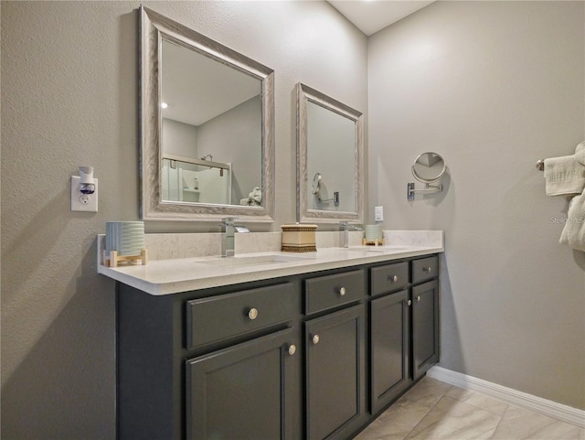 bathroom with a shower with door and vanity