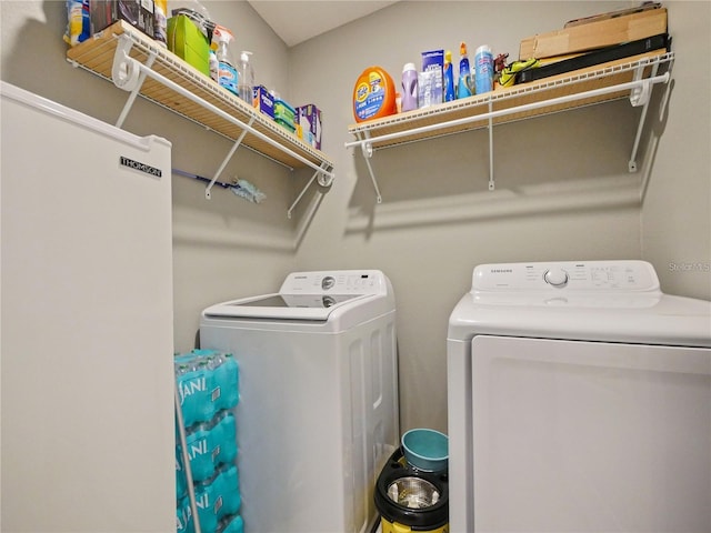 clothes washing area featuring washing machine and dryer