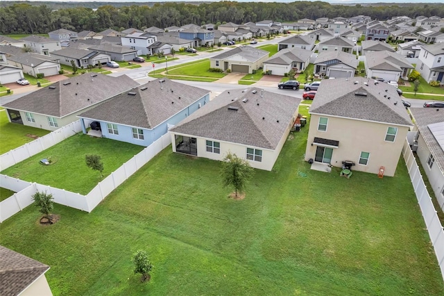 birds eye view of property with a residential view