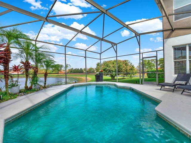 outdoor pool with a lanai, a water view, and a patio area