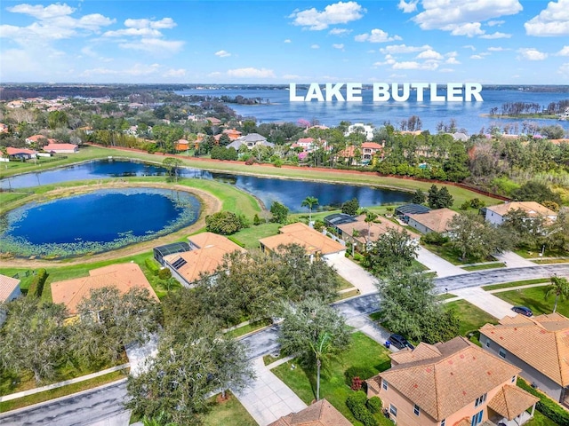 aerial view with a residential view and a water view