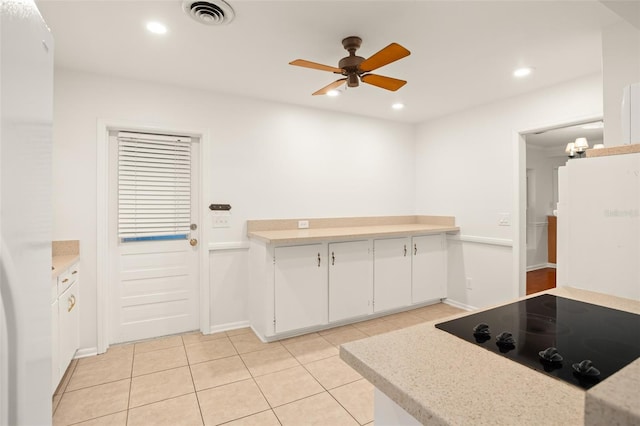 kitchen with visible vents, white cabinetry, recessed lighting, light countertops, and black electric cooktop