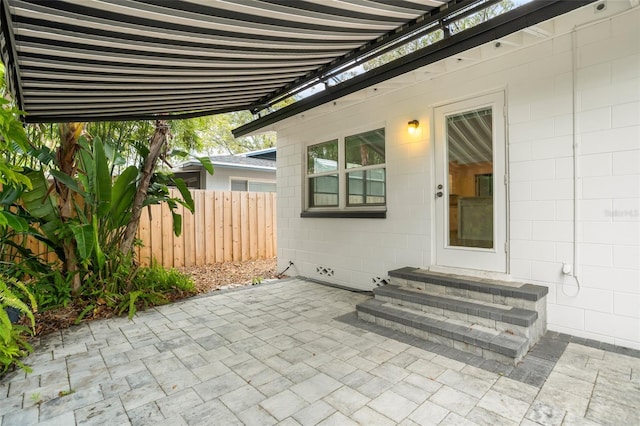 view of patio / terrace with entry steps and fence